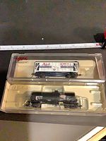 Both Atlas freight cars in original packaging, top view
