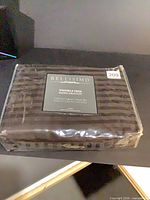 Front view of sealed Bellisimo brown striped full sheet set package