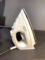 Left side view of Black & Decker QuickPress iron showing entire body and power cord