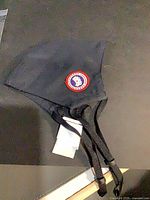 Full view of navy face mask showing overall design and straps