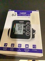 Front view of sealed retail box showing monitor image and features