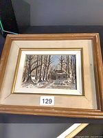 Front view of framed painting showing artwork, frame, signature, wear on frame