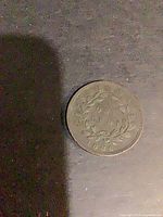 Reverse side with wreath, denomination and date visible