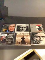 All six Johnny Cash CDs laid out showing front artwork