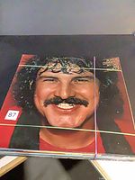 Front cover of Burton Cummings “My Own Way to Rock” LP on top of stack