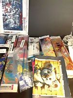 Multiple rolled diamond painting kits and accessory bags