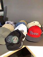 Front view of nine assorted baseball caps
