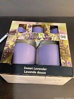 Front view of sealed Mainstays 5-piece Sweet Lavender jar candle set in box