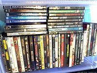 Overall view showing two rows of vertically arranged DVD cases with two horizontal stacks on top