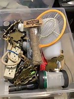 overview of mixed hardware and electrical items in bin