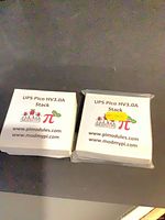Front view of two sealed ModMyPi UPS Pico HV3.0A Stack boxes