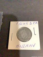 Front view of Netherlands 1 Guilder coin in flip