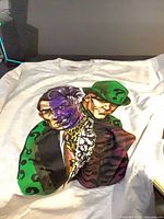 Front view of white T-shirt showing full Riddler and Two-Face graphic