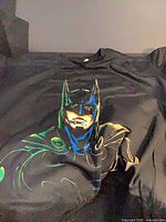 Front view of black Batman graphic T-shirt