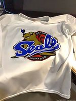 Front view of Orlando Seals hockey jersey showing team logo