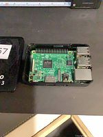 Raspberry Pi 3 Model B inside black case showing overall board and ports