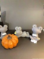Full set of three frog figurines and pumpkin