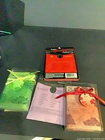 Front view of three sachets (Gardenia, Lavender, Rose) and back of fourth sachet package