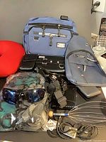 Overall lot with bags, pillow, sunglasses, pouches