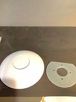Top view of Ubiquiti access point and mounting plate