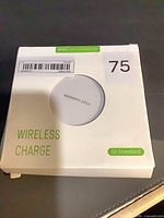 Front of retail box showing charger through cut-out and product text