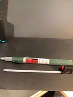 Pole collapsed with tape measure for scale