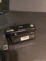 Rear and top view of Yashica Auto Focus S camera showing body wear and attached strap