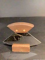 Front view of ulu knife on stand