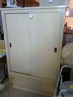 full view of cedar cabinet front with sliding doors