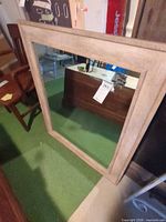 Front view of wood framed mirror