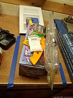 Stacked lot showing boxed oscillating tool, grout tool package, stapler packaging and charger