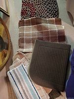 Stacked view of all rugs and towels