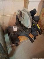 Overall view of Craftsman compound miter saw on wheeled platform