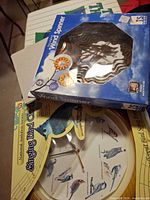 Clock package and wind spinner box stacked