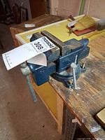 Side view showing Record branding, swivel base and mounting bolts