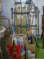 Walker, cane and box with health aids