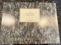 Cloverleaf box lid marked Four Traditional Table Mats