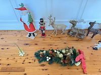 Overall view: Santa cutout, nutcracker, three reindeer, garland, small wood ornaments