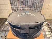 Grey zippered Crock-Pot travel bag closed