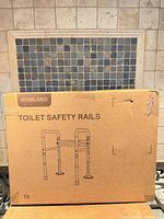 Front view of sealed Homland T8 Toilet Safety Rails box