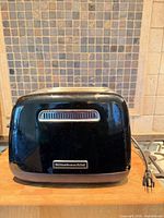 Front view showing KitchenAid logo, black finish and power cord