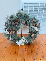 Front view of wreath on stand showing overall size and decorations