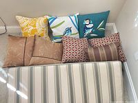 All items overview: bench cushion and eight pillows