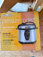 Front of Nesco pressure cooker retail box