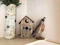 Birch vase, wooden birdhouse, metal quail figure