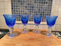 Front view of all four cobalt blue goblets