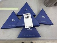 Five blue triangular Swarovski Christmas ornament boxes