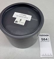 Closed cylindrical Swarovski box bottom showing label CP# 108540