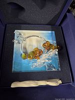 Figurine set in presentation box showing clownfish, coral and photo frame
