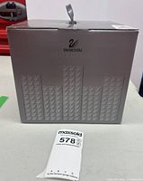 Front of grey Swarovski Silver Crystal box showing brand logo